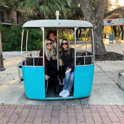 three women in trolley cart in hemisfair park san antonio