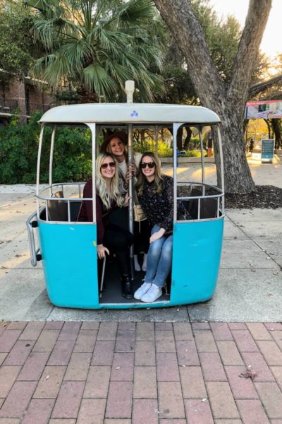 three women in trolley cart in hemisfair park san antonio