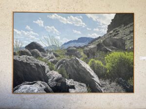 photo of a painting of rocks and landscape